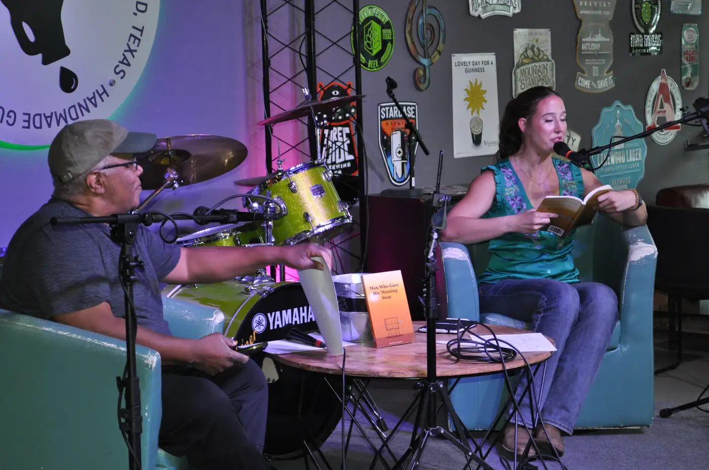 The stage at Guitars and Growlers, two chairs set for a conversation