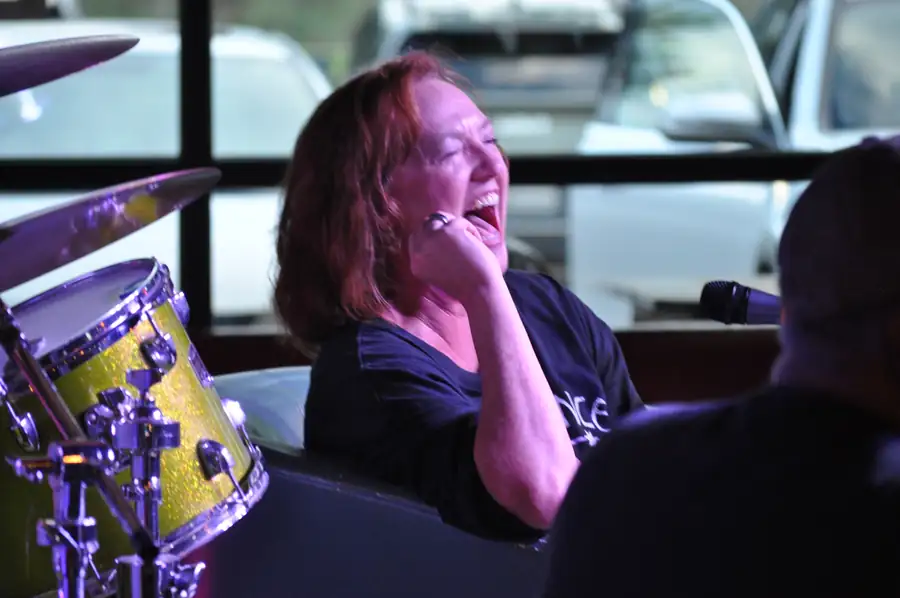 A guest laughs during her interview on The Chair.